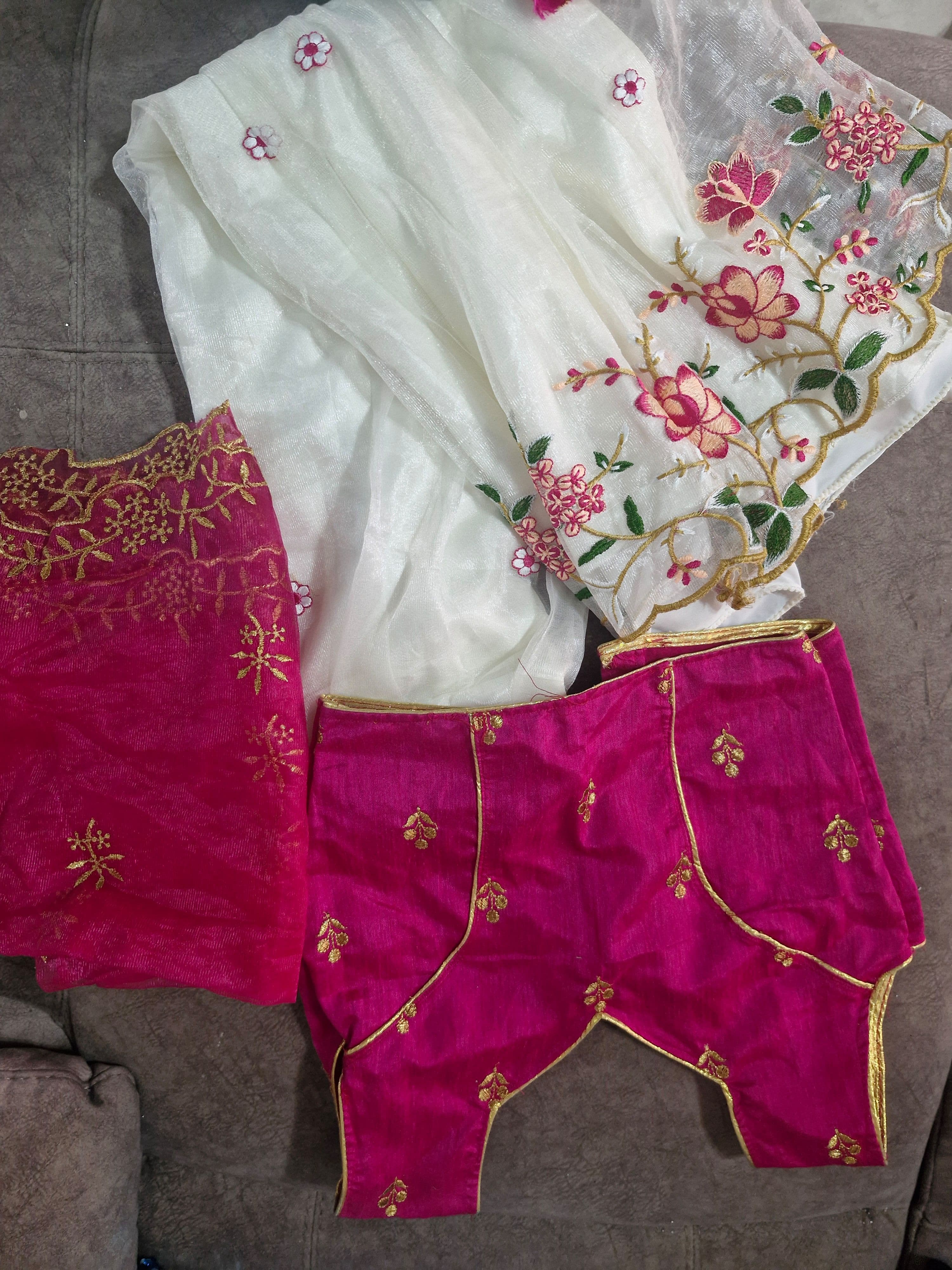 Vibrant Pink Blouse with Gold Zari Embroidery, white lehenga and net dupatta