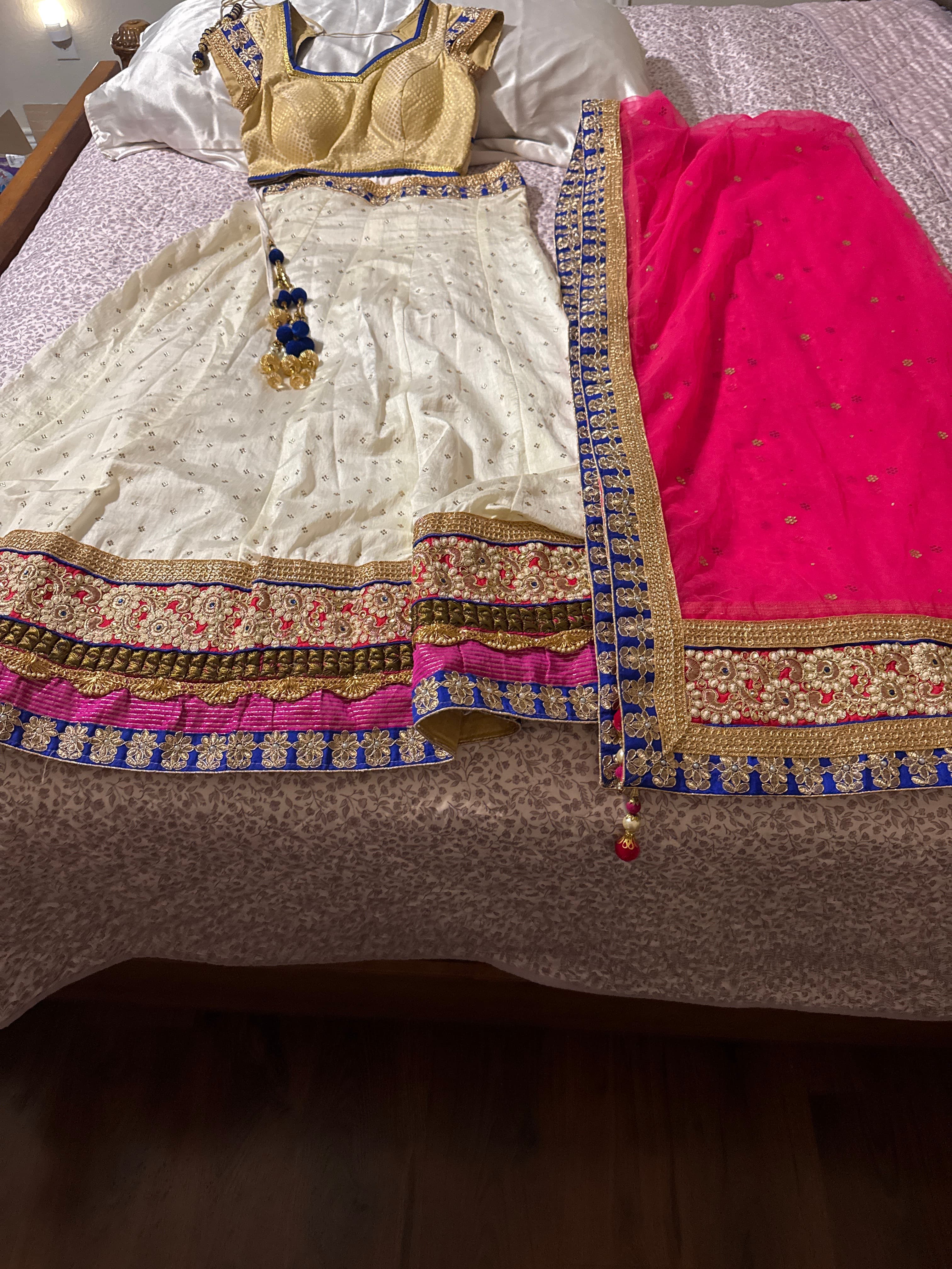 Elegant Cream & Gold Lehenga with Royal Blue and Hot Pink Accents