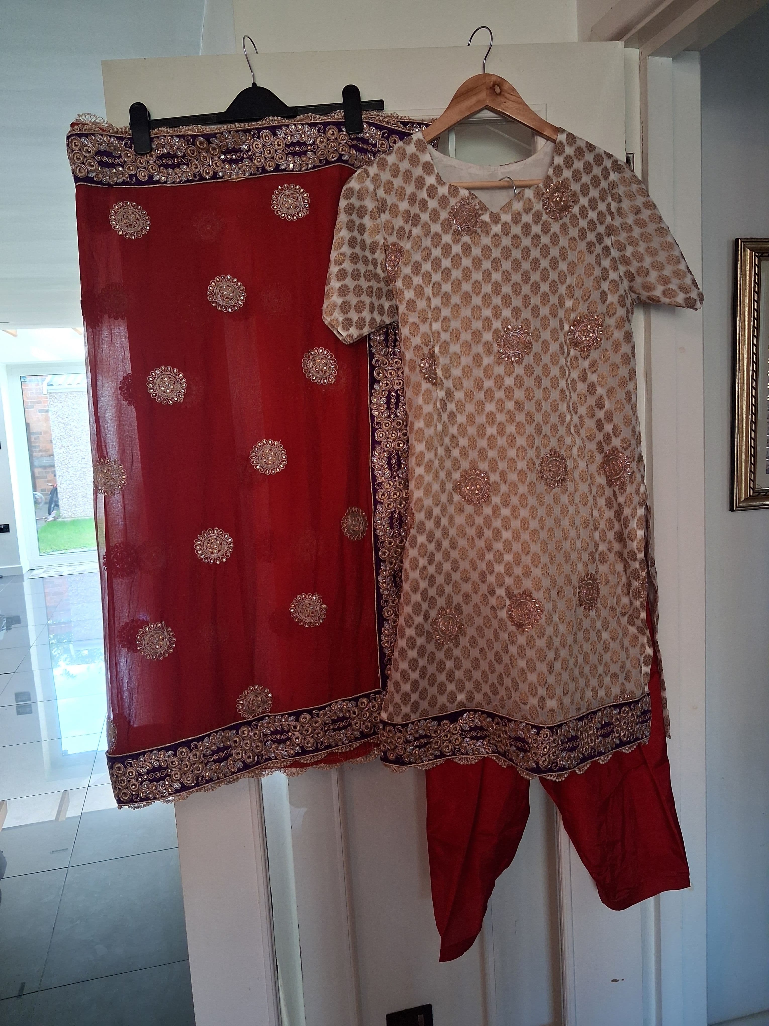 Elegant Cream & Red Salwar Suit with Gold Embroidery and Purple Border