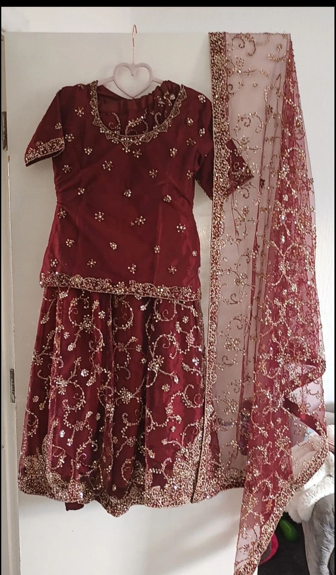 Deep red bridal lengha. South asian wedding outfit.