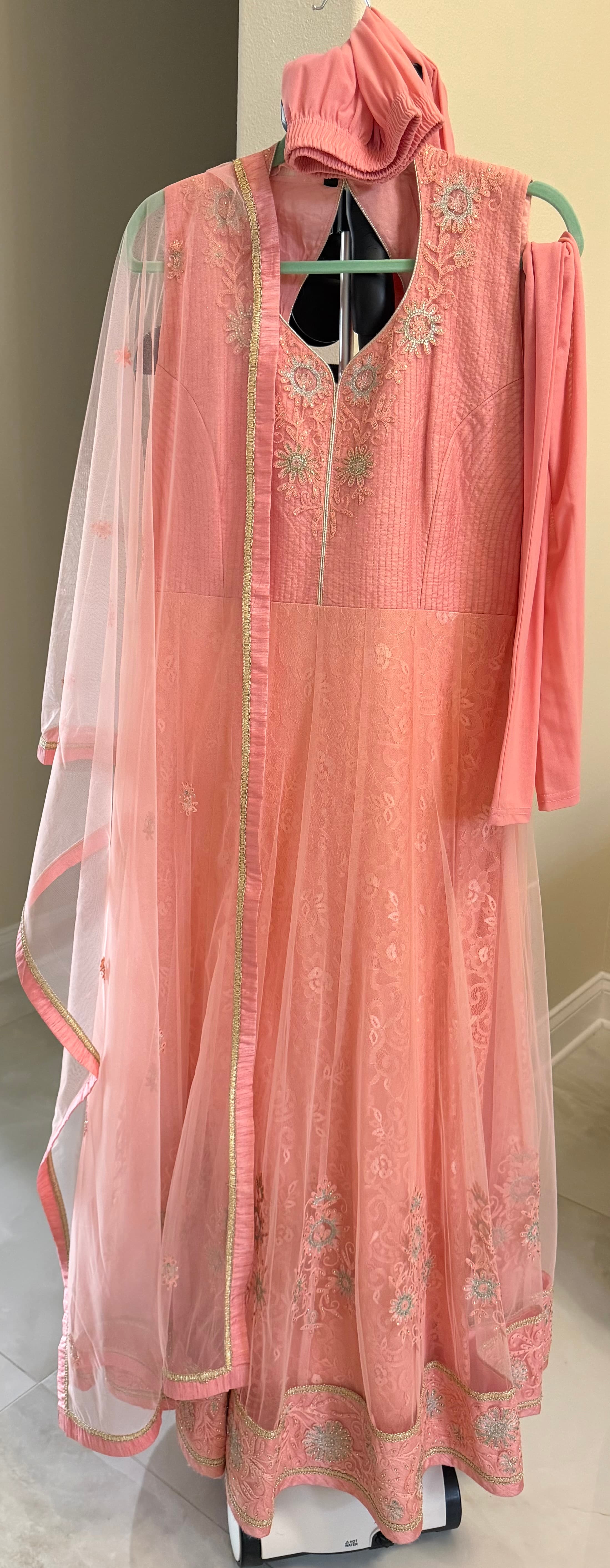 Elegant Peach Anarkali Suit with Intricate Embroidery and Net Dupatta
