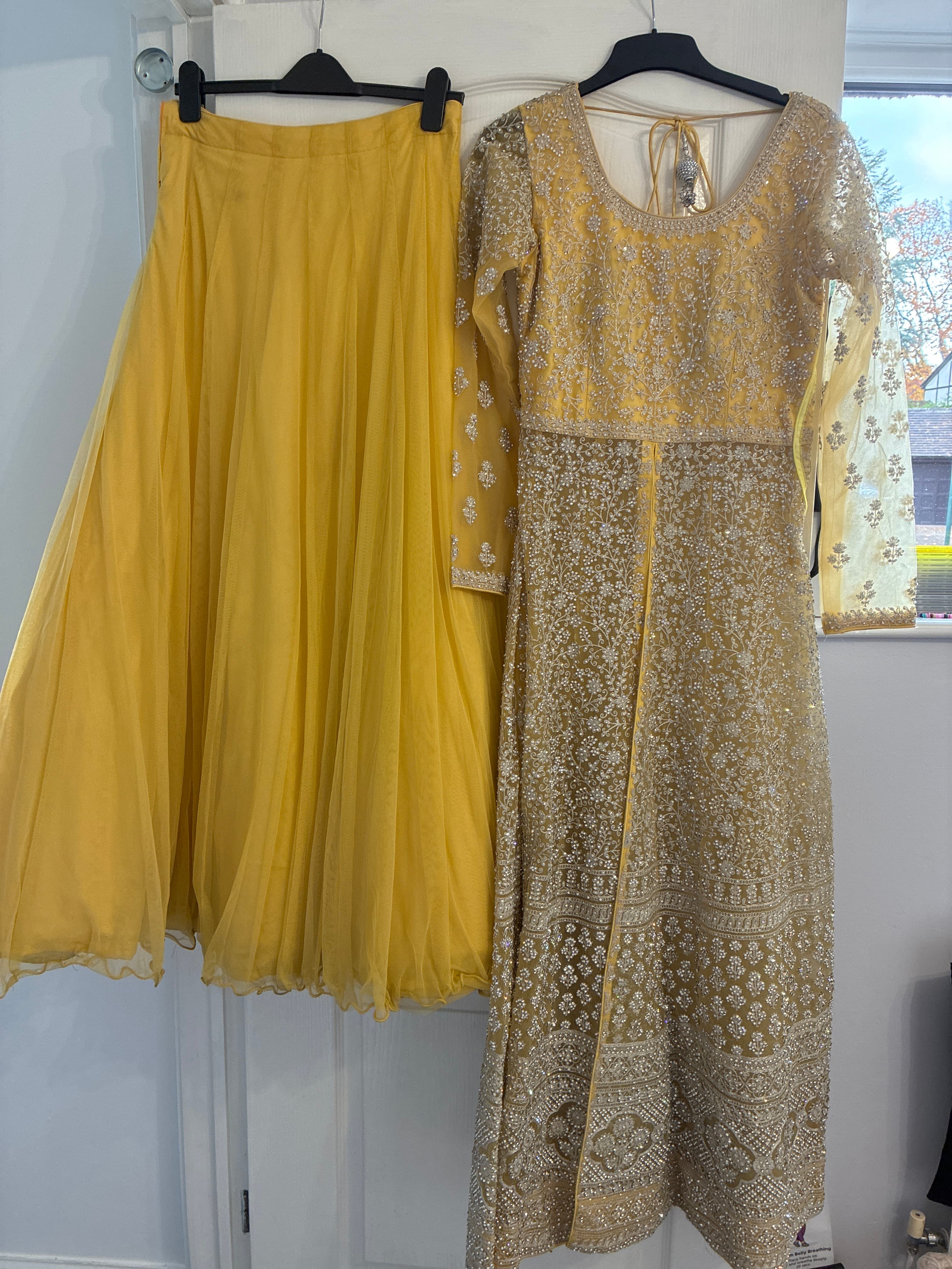 Stunning Yellow Net Lehenga with Silver Embroidery and Full Sleeves