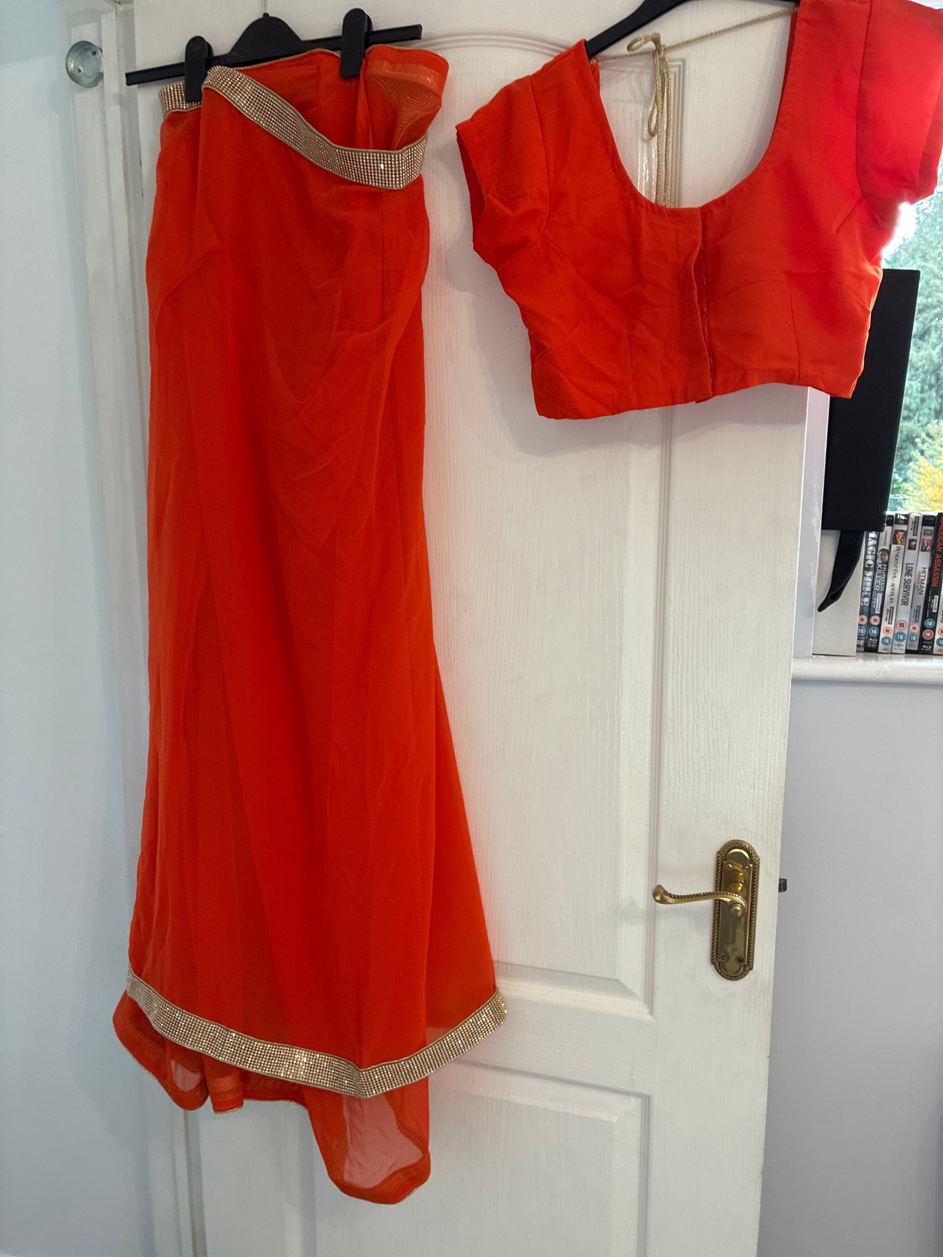 Vibrant Orange Saree with Crystal Embellished Border and Matching Blouse