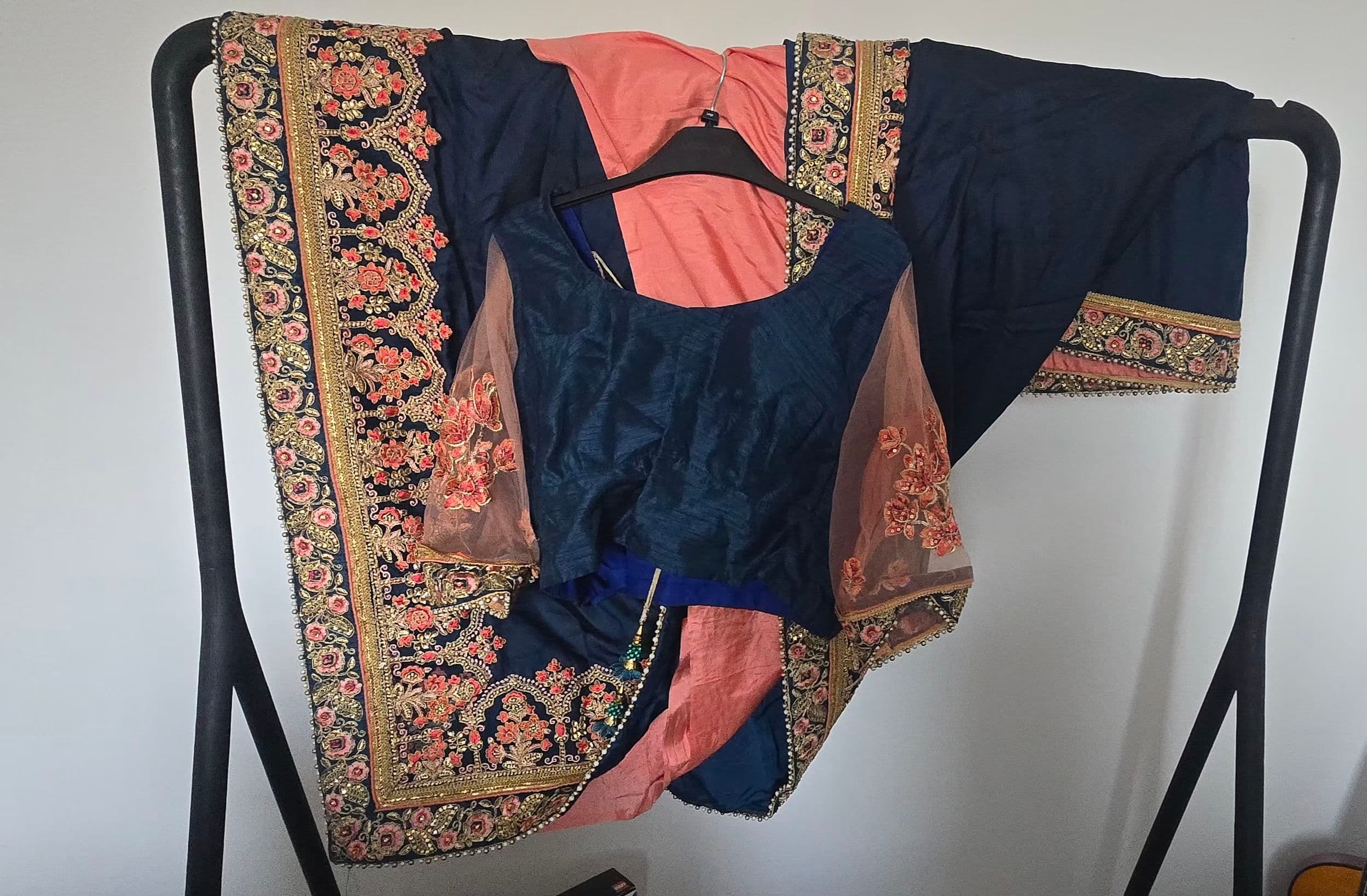 Elegant Navy Blue and Peach Saree with Intricate Floral Embroidery and Sequin Work