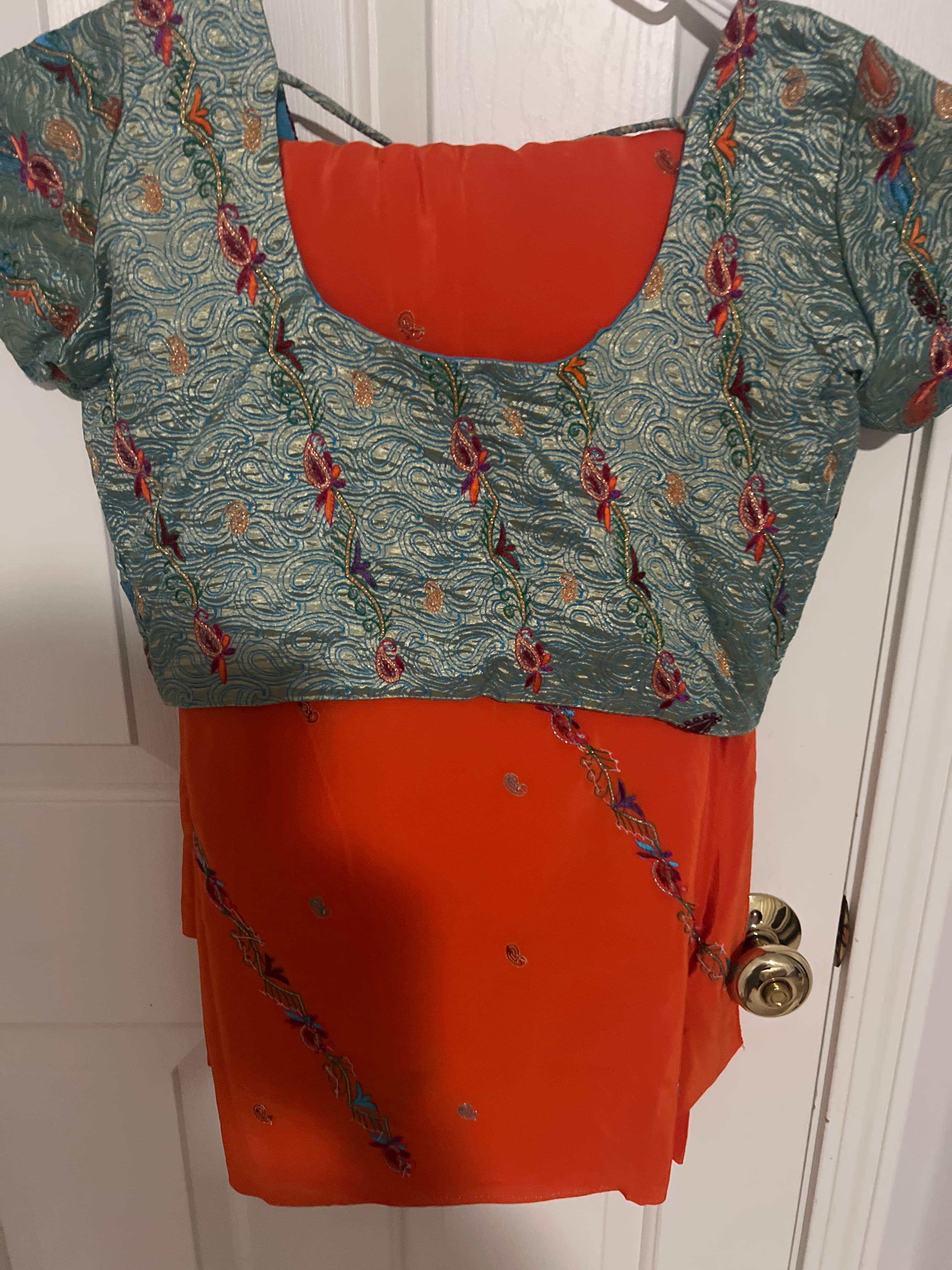 Orange saree with blue blouse