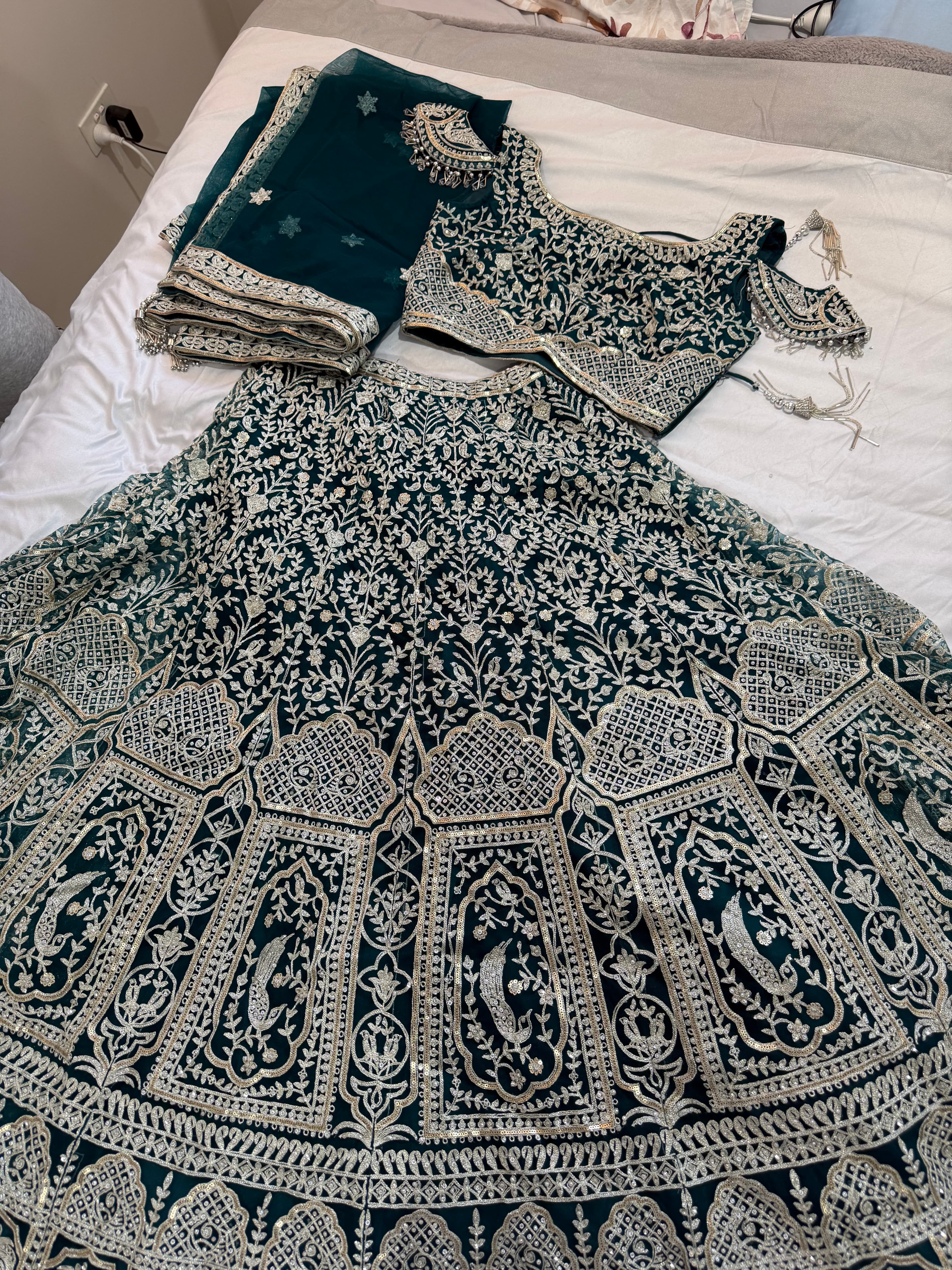 Stunning Emerald Green Bridal Lehenga with Intricate Silver Embroidery