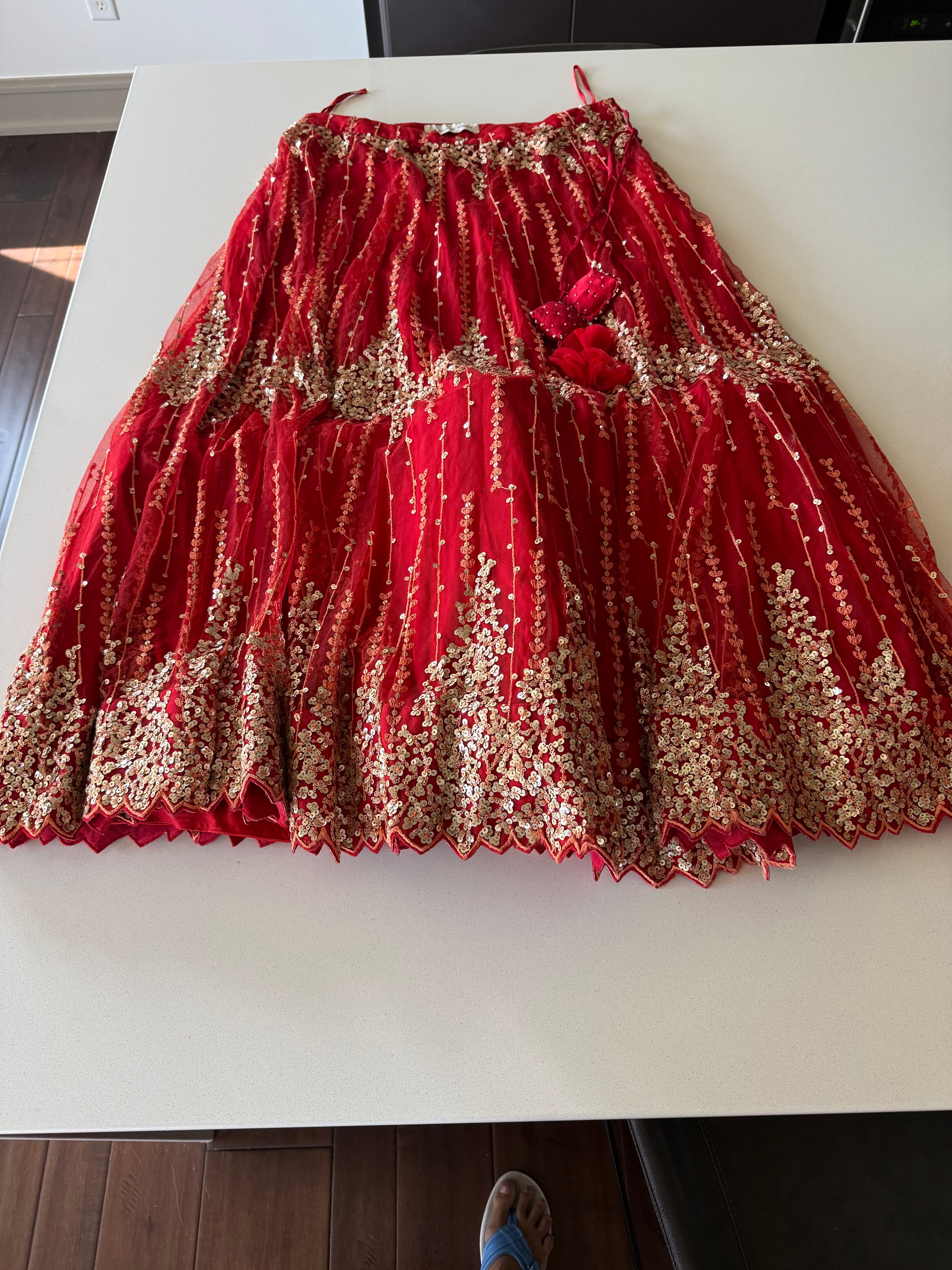 Stunning Red Lehenga with Gold Sequin and Thread Work, Ruffled Blouse, and Net Dupatta