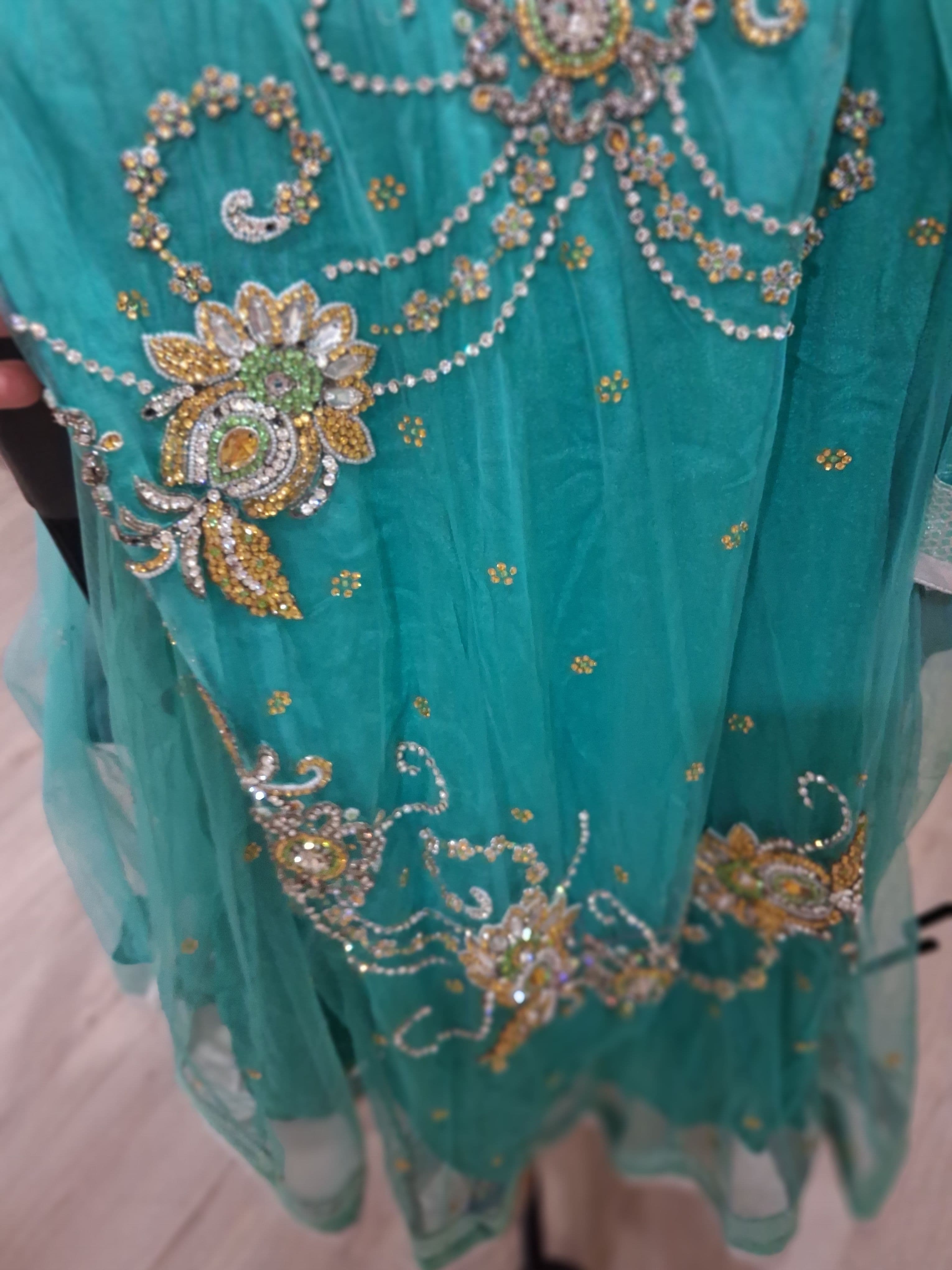 Elegant Teal Net Suit with Intricate Gold and Silver Embroidery