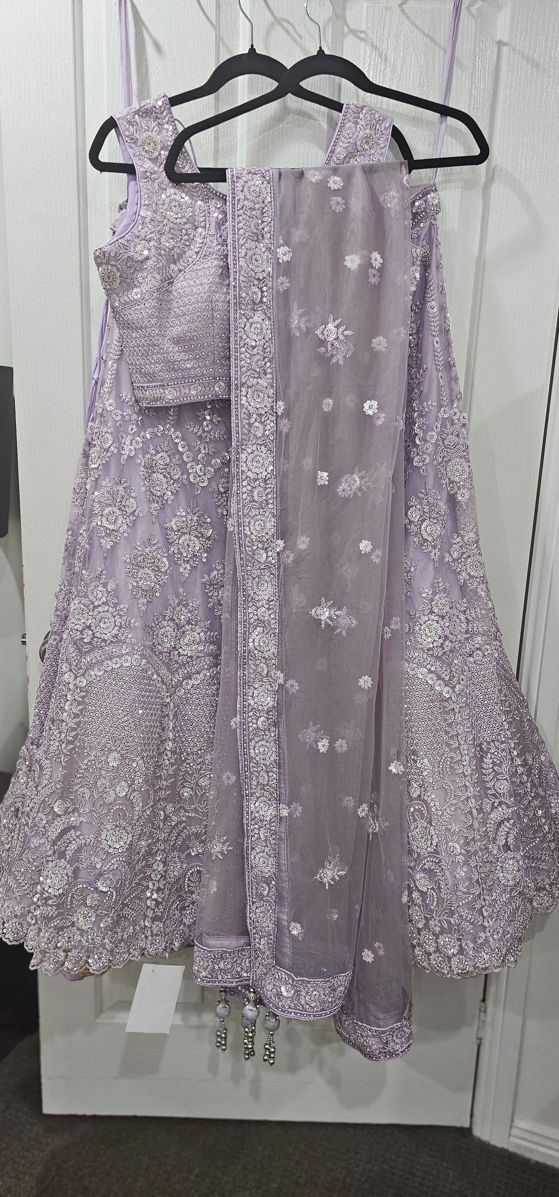 Stunning Lavender Net Lehenga Choli with Intricate Silver Sequin and Thread Work