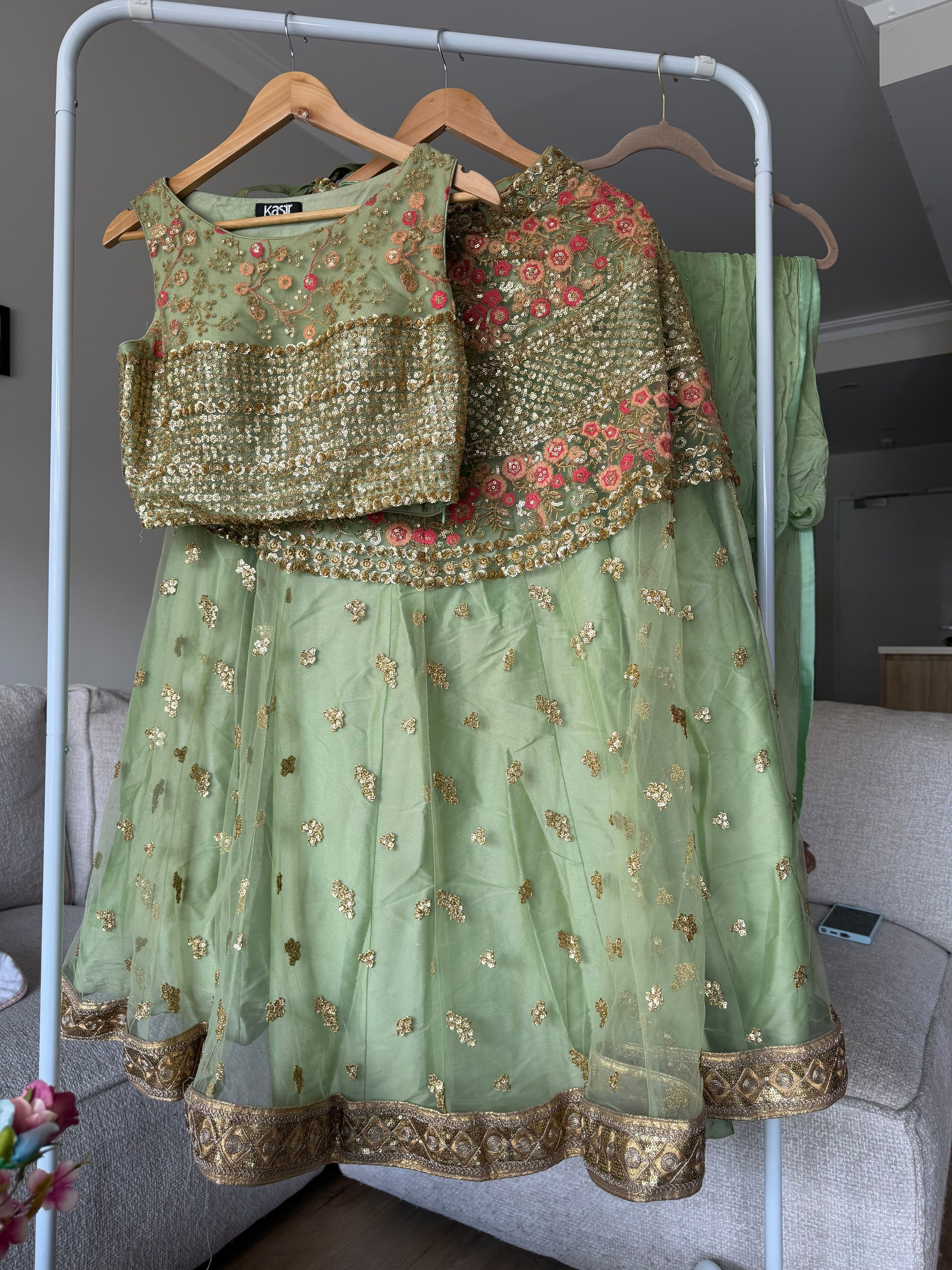 Stunning Sage Green Net Lehenga with Gold Sequin & Floral Thread Work